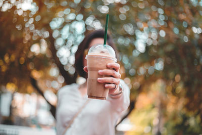 Midsection of person holding ice cream cone