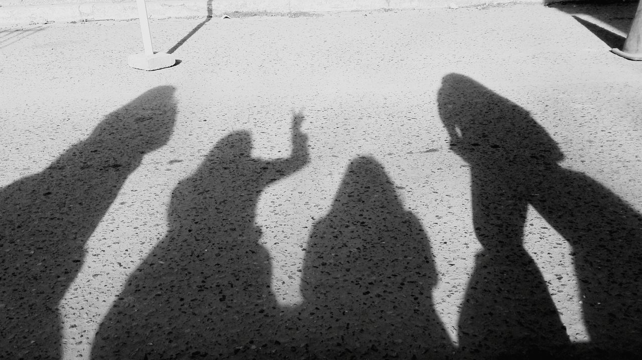 shadow, sunlight, focus on shadow, togetherness, human hand, leisure activity, lifestyles, standing, real people, holding, human body part, day, people, outdoors, friendship, adults only, adult