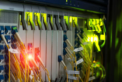 Close-up of yellow cables attached to electrical equipment