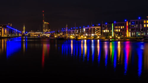 Reflection of illuminated buildings in water