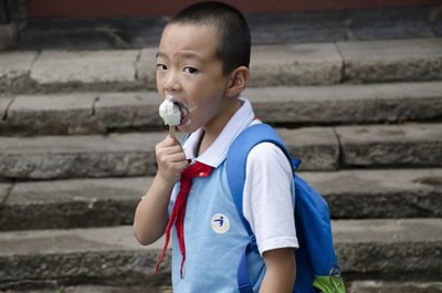 Close-up of cute boy holding ice cream