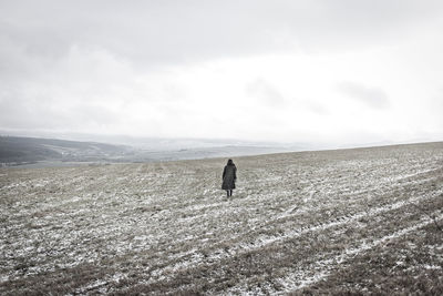 Full length of woman on field against sky