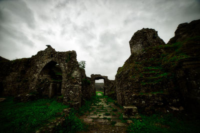 Old ruin building against cloudy sky