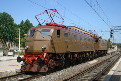 Train on railroad track against clear sky