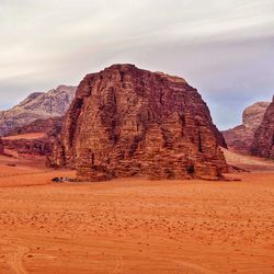 Rock formations in desert against sky