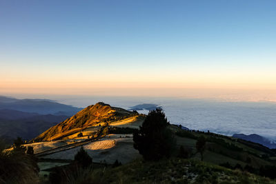 Scenic view of sea against clear sky during sunset