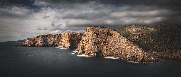 Dark look coastal stacks of cala domestica, sardinia, sulcis iglesiente