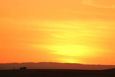 Scenic view of silhouette landscape against sky during sunset