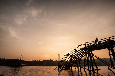 Silhouette pier against sky during sunset