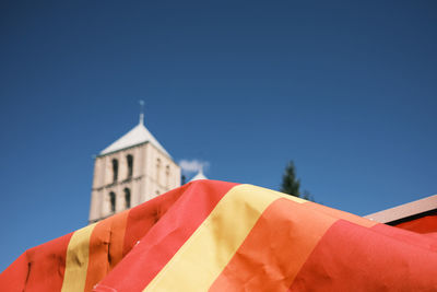 Low angle view of building against blue sky