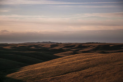 View of landscape against cloudy sky