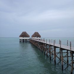 Pier over sea against sky