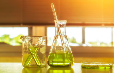 Close-up of laboratory glassware on table 