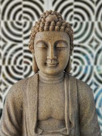 Close-up of statue against temple