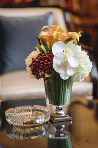 Close-up of flower vase on table