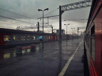 Train at railroad station against sky