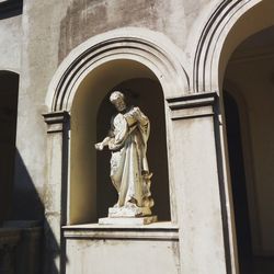 Statue of angel outside building