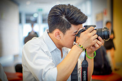 Portrait of man photographing