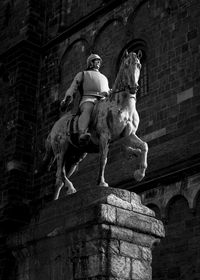 Low angle view of statue against building