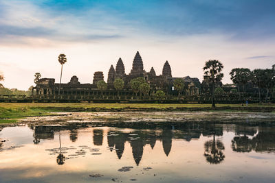 Sunrise in angkor wat, a temple complex in cambodia and the largest religious monument in the world