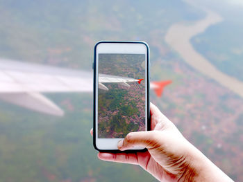 Man photographing through smart phone