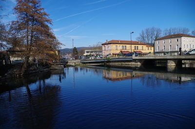 River by city against clear blue sky