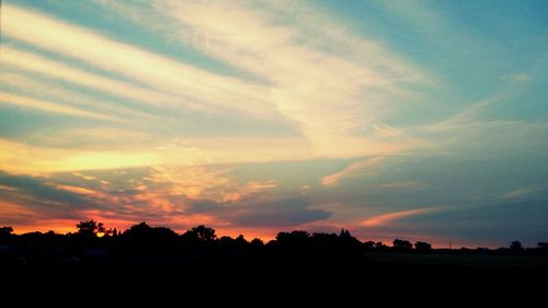 Scenic view of silhouette landscape against sky during sunset