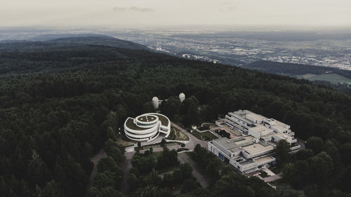 High angle view of trees and buildings against sky