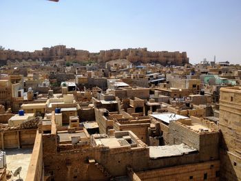 High angle view of buildings in city against sky