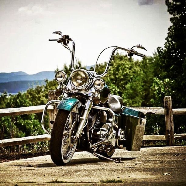 bicycle, transportation, land vehicle, mode of transport, parked, stationary, parking, tree, tranquility, absence, nature, tranquil scene, sunlight, wheel, no people, day, sky, mountain, outdoors, beauty in nature