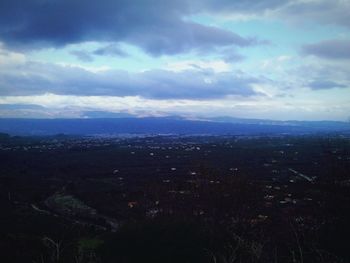 Scenic view of landscape against cloudy sky