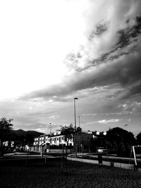 People in front of building against sky