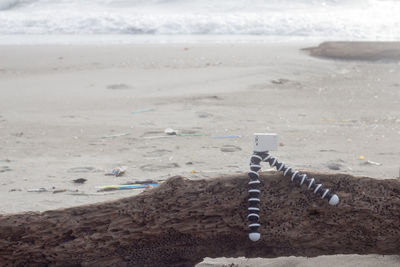 High angle view of text on sand at beach