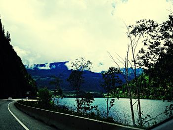 View of river against cloudy sky