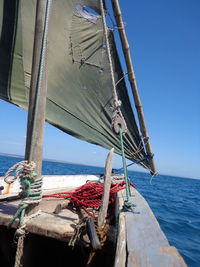 Cropped image of boat sailing in sea