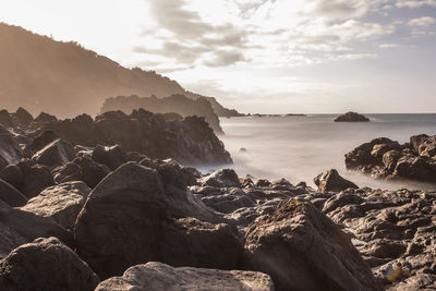 Scenic view of sea against sky at sunset