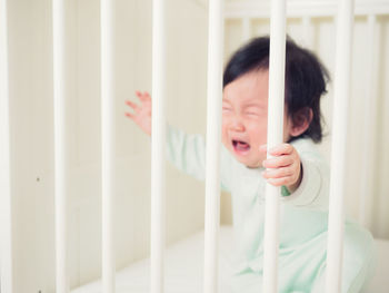 Close-up of cute baby girl at home