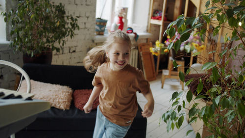 High angle view of girl running at home