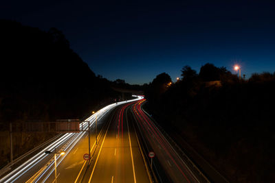 High angle view of light trails on railroad track