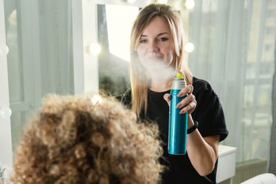 Portrait of beautiful woman drinking glass