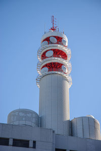 Low angle view of building against clear blue sky