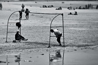Full length of boy running on beach