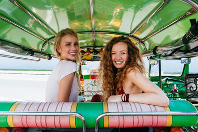 Women sitting in jinrikisha