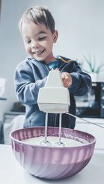 Portrait of cute boy eating food