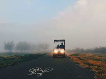 Vehicle on road along countryside landscape