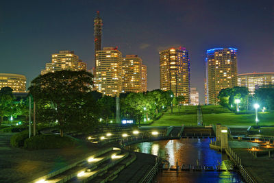 Illuminated buildings in city at night