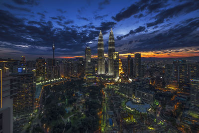 Aerial view of city lit up at night