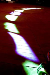 Illuminated lights on tiled floor