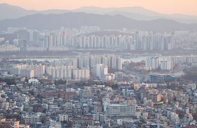 High angle view of buildings in city against sky