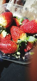 Close-up of strawberries in plate on table